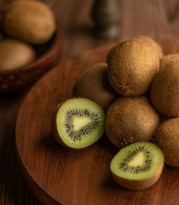 brown round fruit on brown wooden table